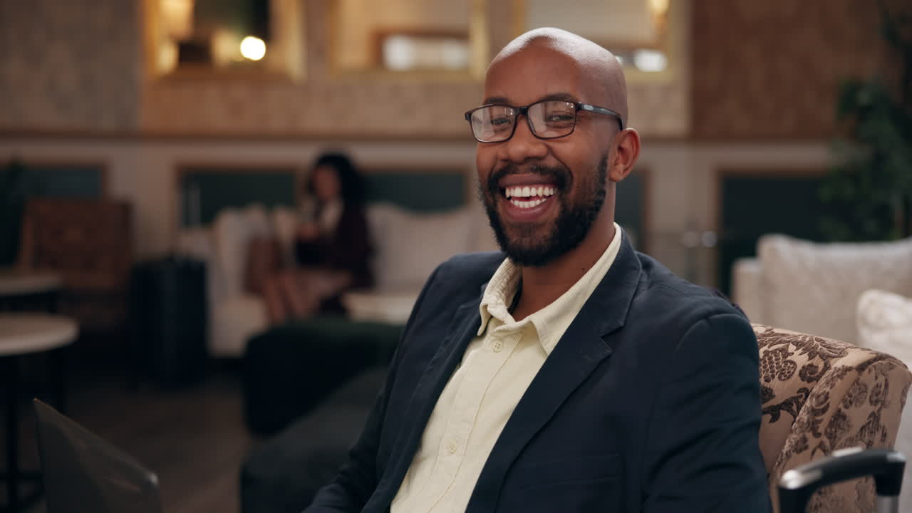 Smiling businessman in hotel lobby