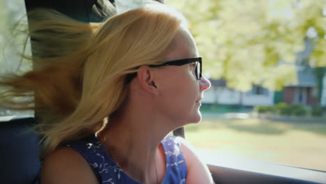 woman looking out of car window