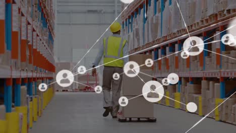 animation of network of connections with icons over caucasian man in warehouse