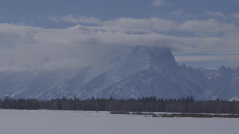 Handheld-shot-of-the-Teton-Range-with-clouds-covering-the-high-mountain-peaks