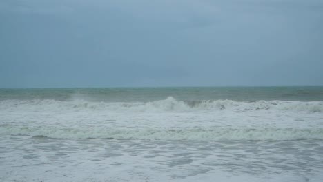 waves crashing on purworejo empty beach, central java. indonesia. static view