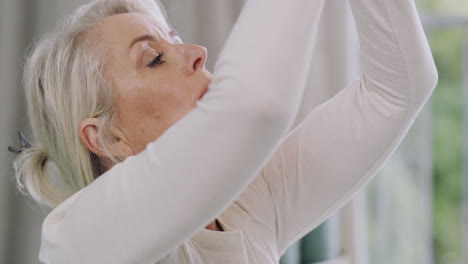 closeup of one senior caucasian woman meditating