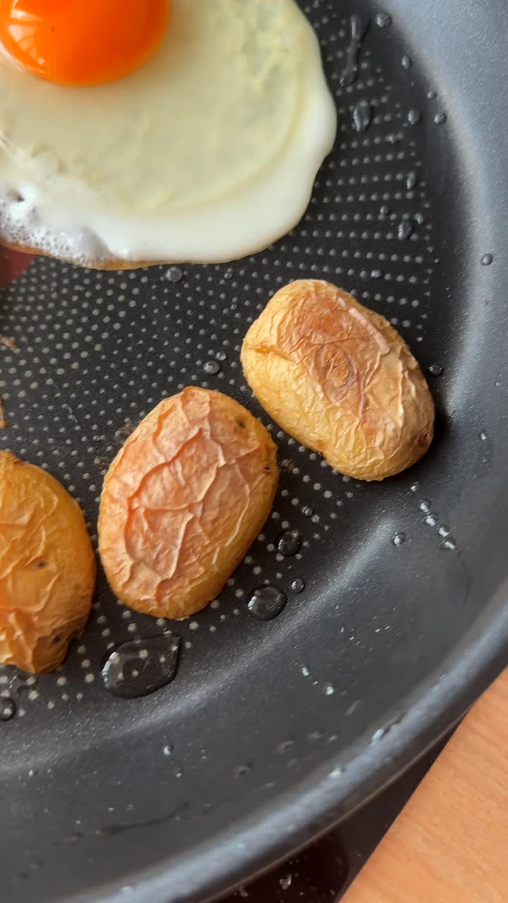 Cooking Fried Eggs and Roasted Potatoes in a Pan