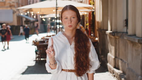 displeased upset teen child girl reacting to unpleasant awful idea wave hand finger shake head no