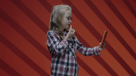 girl taking a selfie with lipstick