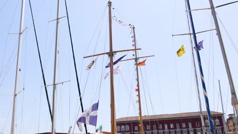 flags waving on a ship's mast