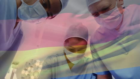 Animation-of-waving-germany-flag-against-team-of-surgeons-performing-surgery-at-hospital