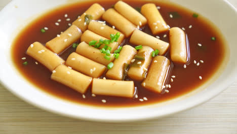 spicy jjajang tteokbokki or korean rice cake in spicy black bean sauce - korean food style