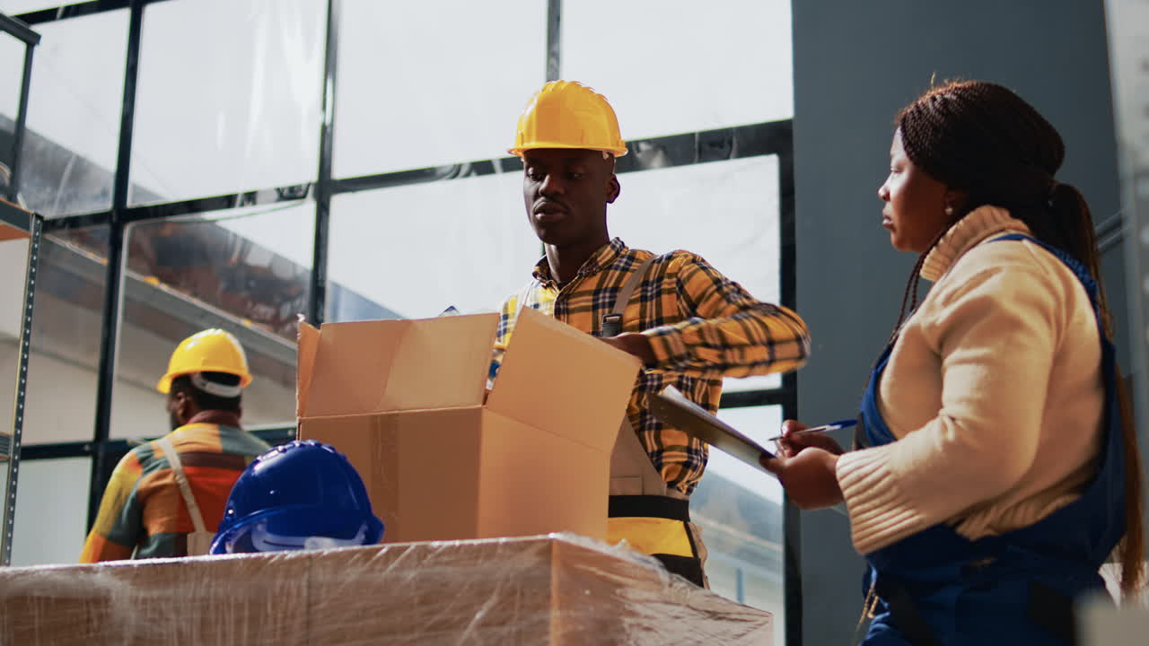 Warehouse workers packing boxes