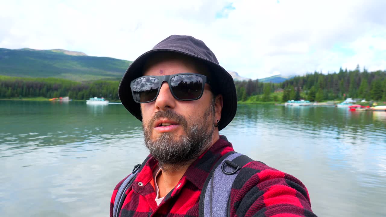 Man taking selfie at scenic lake