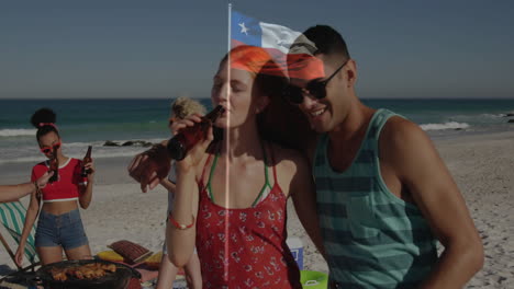 young adults enjoying drinks at beach with chilean flag overlay animation