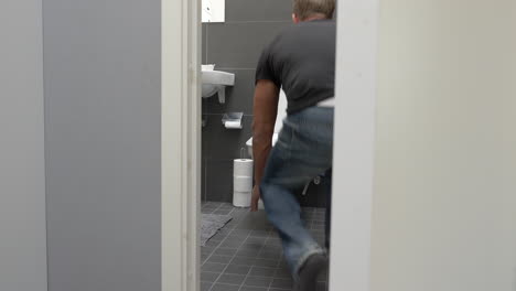 man running to toilet and vomit