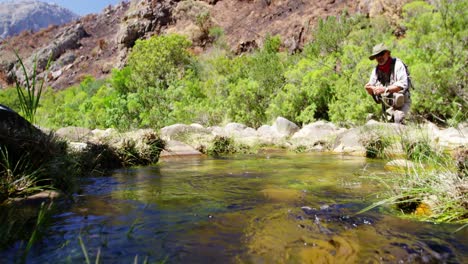 Fisherman-fly-fishing-in-river