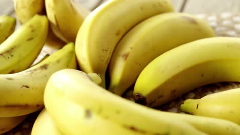 fresh bananas on wooden plank