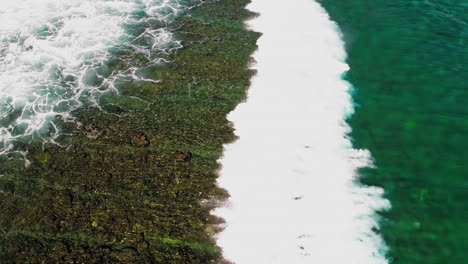 stunning aerial footage of the gili islands, indonesia. crystal-clear waters, white sand beaches, coral reefs, and boats in paradise. ideal for travel, nature, and tropical themes