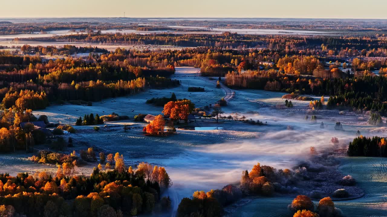 Scenic aerial view of autumn foggy landscape in early morning light