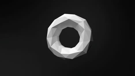 low-poly white torus on a dark background