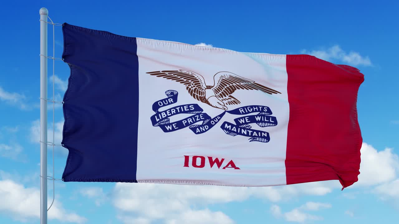 바람에 흔들리는 발 기둥에 있는 아이오와 발, 파란 하늘 배경.