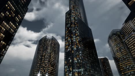 edificios de oficinas de rascacielos de vidrio con cielo oscuro