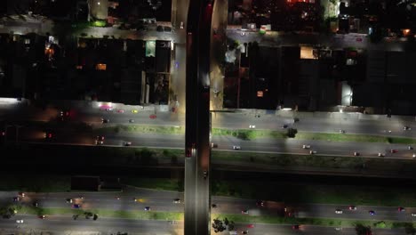 nighttime aerial view of ecatepec's illuminated streets and houses