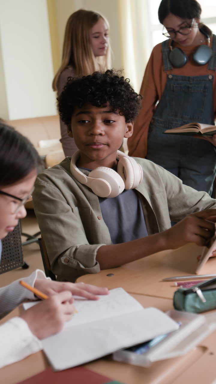 Diverse group of students learning and interacting in a classroom