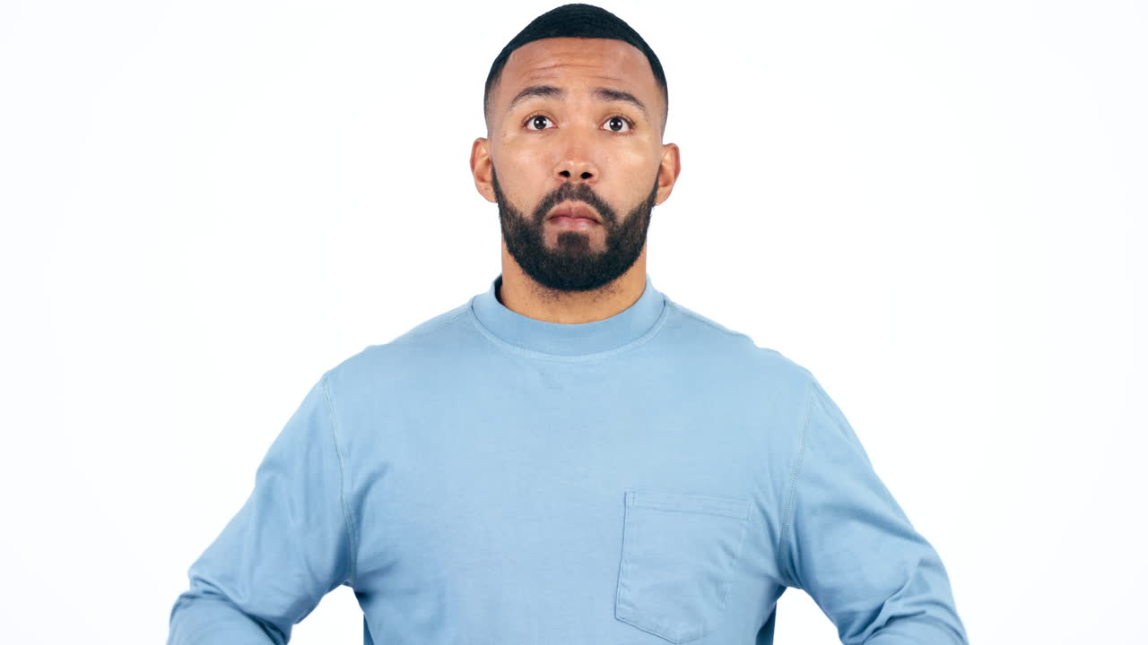 Face, mind blown and surprise of man in studio