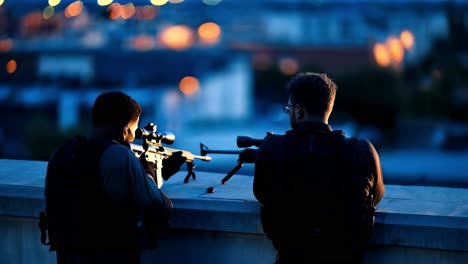 snipers on rooftop at night