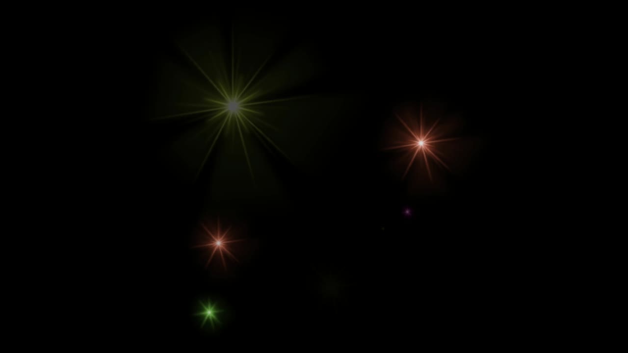Animation orange light sparkles on black background.