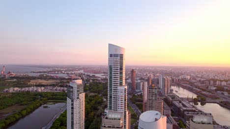 aerial orbit establishing the skyscrapers of puerto madero in an epic sunset in this exclusive area of buenos aires, alvear tower