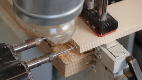 woodworking machine drilling wood panel