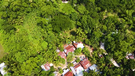 an indigenous village with tin shed houses belonging to an aboriginal community - aerial topdown shot