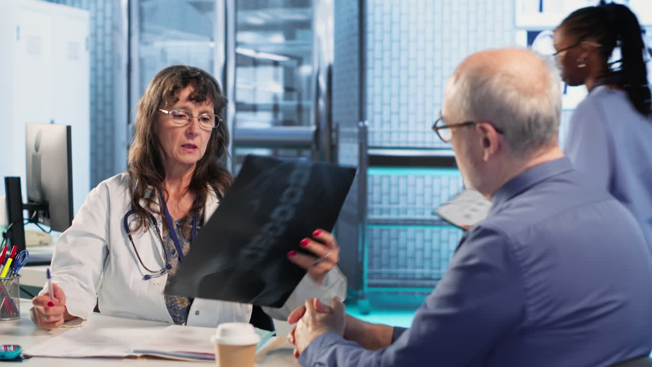 Vertical Video Medic gives a bad concerning diagnosis to elderly patient at checkup