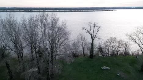 Sunset-by-Lake-in-Bourg-sur-Gironde,-Bordeaux,-France---aerial