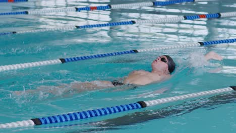 swimmers swimming into the pool