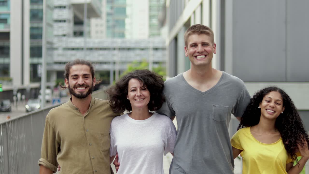 Happy young people walking on street