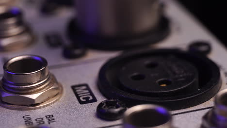 Plug In XLR Microphone Connector and Cable to Mixing Console, Macro Close Up