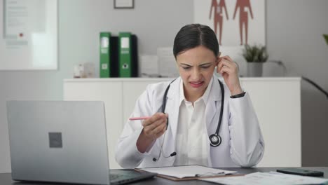 Confused-Indian-female-doctor-student-studying-for-exams