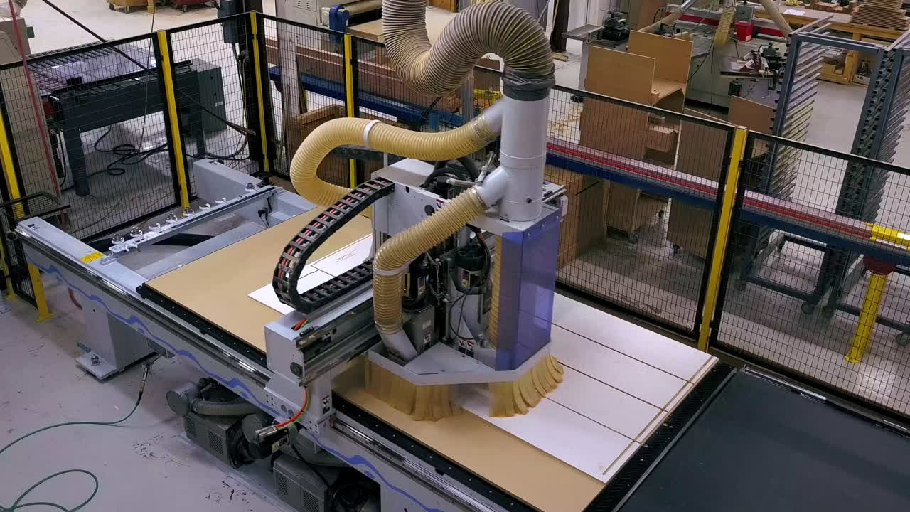 a CNC wood cutter or carver carving out kitchen cabinets