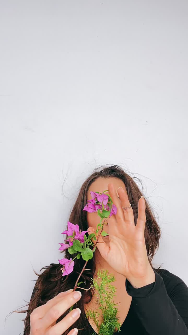 Woman holding bougainvillea flowers