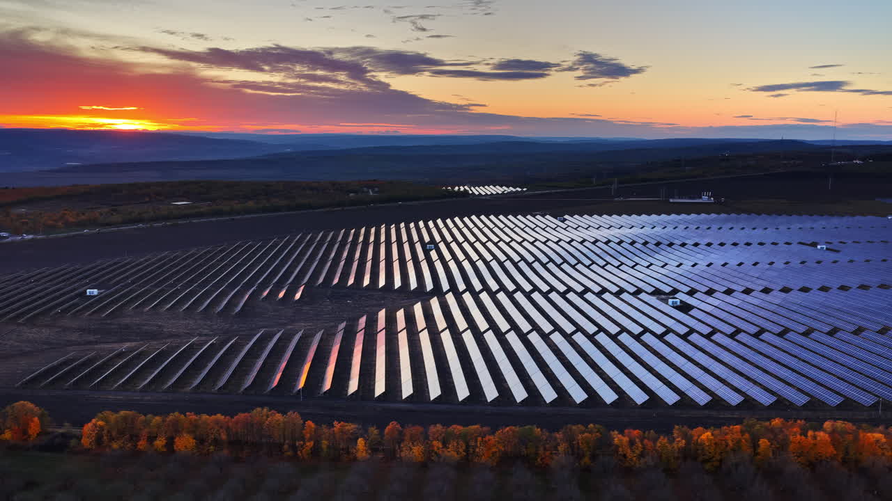 Aerial drone view of a large solar panel field in Moldova at sunset