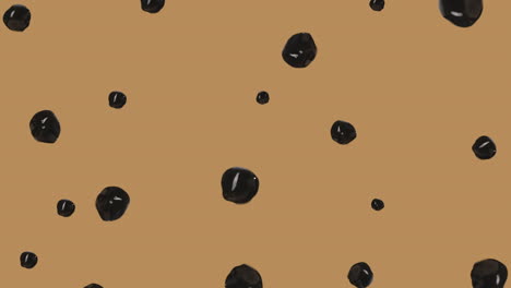 stream of brown tapioca balls rolling and levitating with chocolate colored background