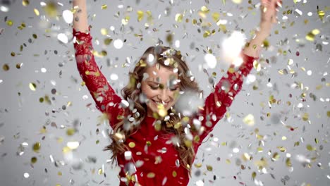 woman dancing under shower of confetti