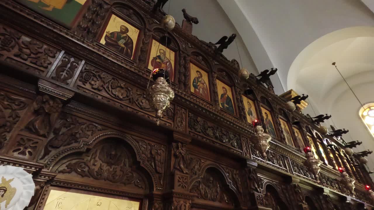 Explore the stunning architecture and elaborate wooden details of this historic church. The environment is illuminated by soft light, enhancing the beauty of ancient icons
