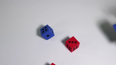 multicolored dice tumbling down onto surface