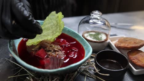 preparing a traditional russian borscht dish