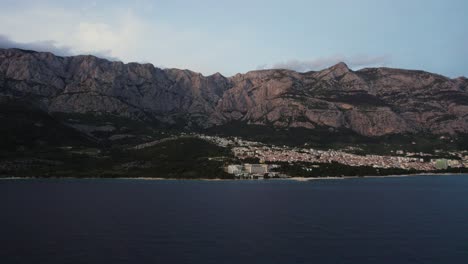 aerial flyover of the adriatic sea and coastline surrounding makarska in croatia