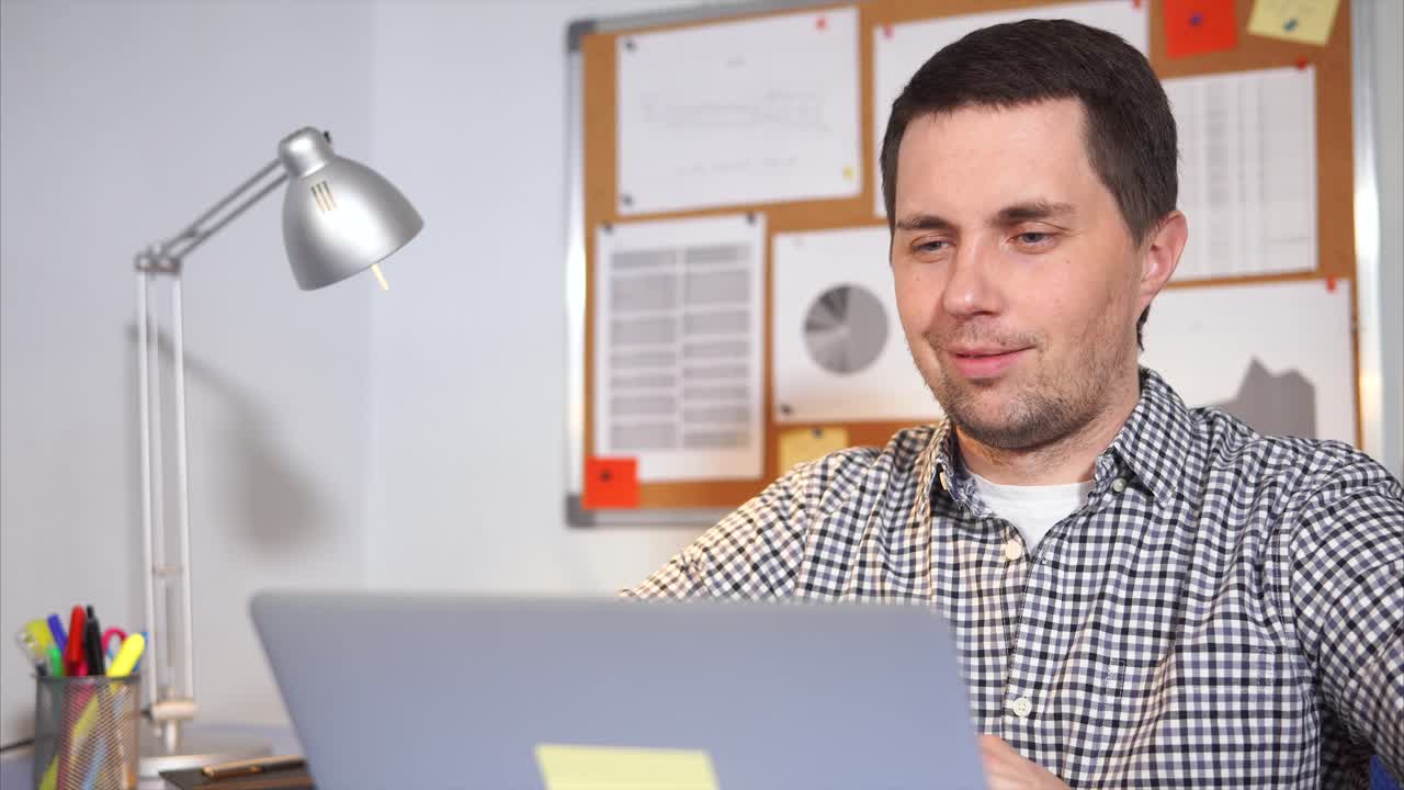 Businessman Working on Laptop and Giving Thumbs Up