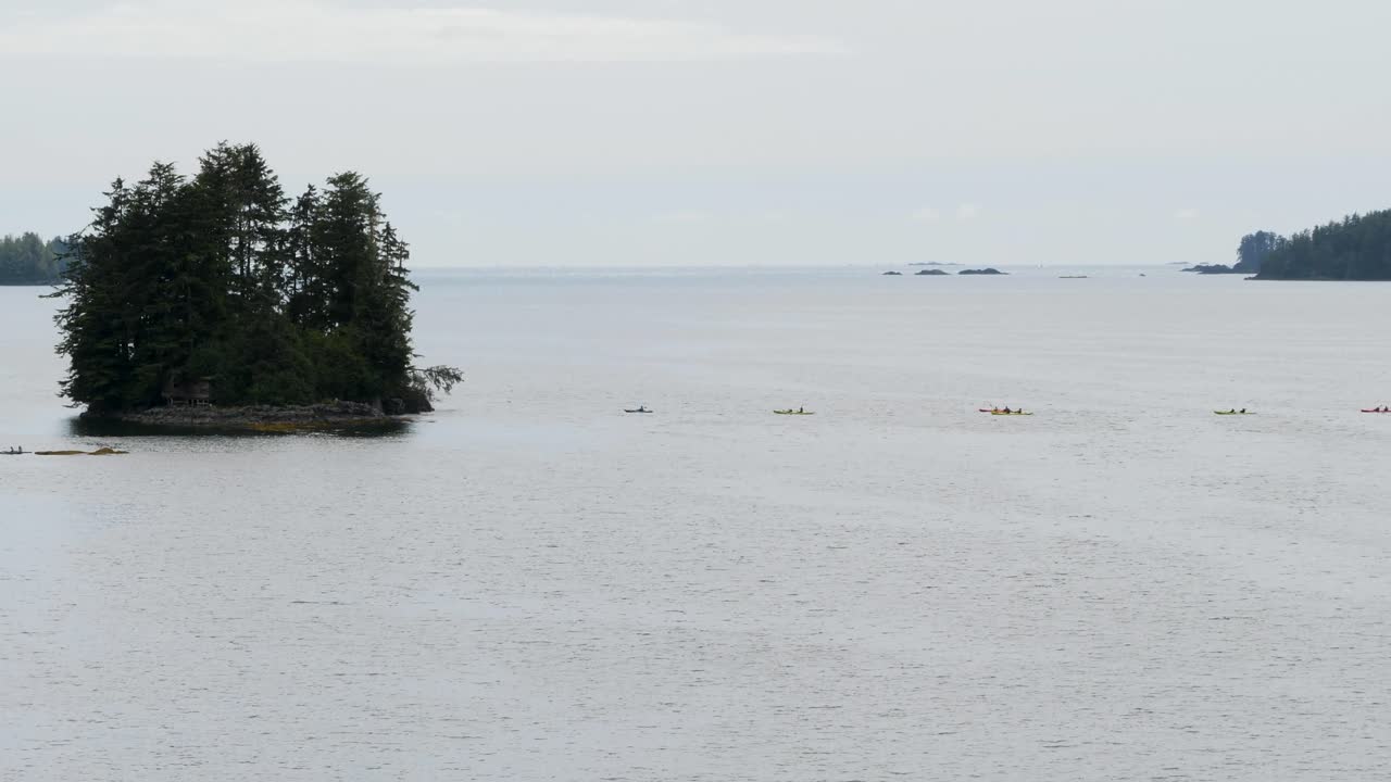 Tourists sea kayaking in Sitka, Starrigavan Bay, Alaska.Outdoors activity in vacation.