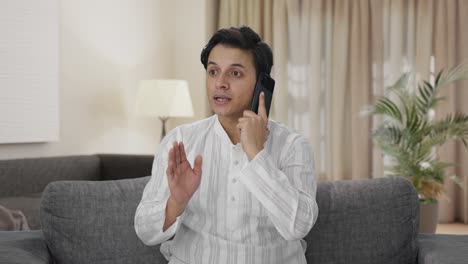 indian man talking on phone