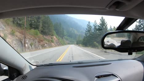 car driver's pov, time lapse driving through mountain landscape